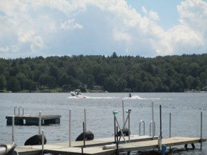 My nephew waterskiing in a boat driven by cousins. Kauneonga Lake 2013.