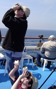 My husband and son watching the start of an eclipse from a cruise ship near Greece.