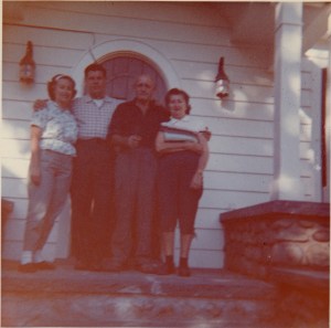 My parents and grandparents in front of the home in 1962.  My siblings and I now own it.