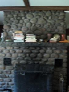 The fireplace in the center of the living room.